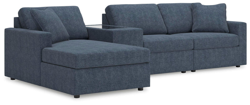 Ashley Furniture Modmax sectional with chaise, featuring modern design, neutral upholstery, and plush cushions.