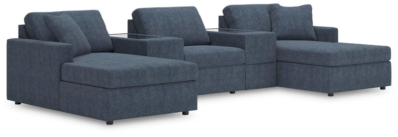 Ashley Furniture Modmax Pit Sectional with plush fabric and modern design, shown in a spacious living room setting.