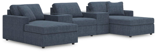 Ashley Furniture Modmax Pit Sectional with plush fabric and modern design, shown in a spacious living room setting.
