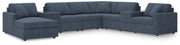 Ashley Furniture Modmax sectional with chaise, featuring plush cushions and modern design in neutral fabric.