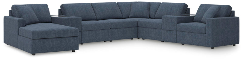 Ashley Furniture Modmax sectional with chaise, featuring plush cushions and modern design in neutral fabric.