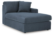 Ashley Furniture Modmax sectional with chaise, angled view showing modern fabric upholstery and spacious seating arrangement.