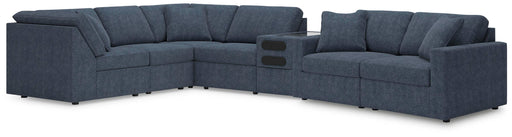 Ashley Furniture Modmax sectional with integrated audio console, featuring plush seating and modern design in a stylish living room setting.