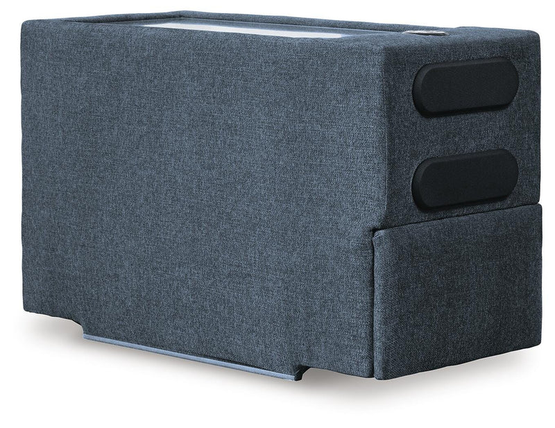 Ashley Furniture Modmax sectional with chaise, showing a modern fabric sectional sofa with a chaise lounge from an angled view.