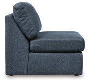 Ashley Furniture Modmax 6-piece sectional sofa with modern design, featuring multiple cushions and neutral fabric upholstery.