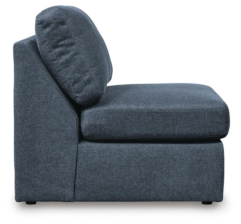 Ashley Furniture Modmax 6-piece sectional sofa with modern design, featuring multiple cushions and neutral fabric upholstery.