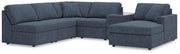 Ashley Furniture Modmax sectional with chaise, featuring modern design and plush cushions in a stylish living room setting.