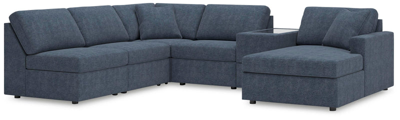 Ashley Furniture Modmax sectional with chaise, featuring modern design and plush cushions in a stylish living room setting.