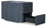 Ashley Furniture Modmax balanced sectional with built-in audio and storage consoles, shown from an angled open view.