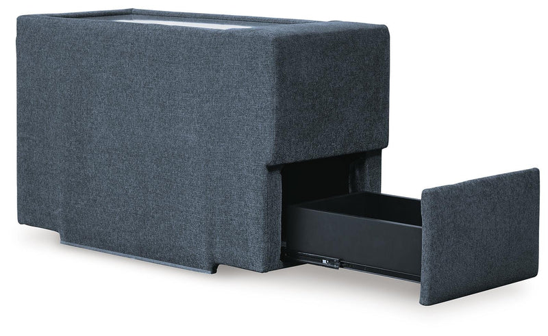 Ashley Furniture Modmax balanced sectional with built-in audio and storage consoles, shown from an angled open view.