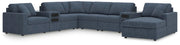 Ashley Furniture Modmax sectional with built-in audio system and chaise, featuring modern upholstery and plush seating.