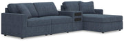 Ashley Furniture Modmax sectional with chaise, featuring plush cushions and modern design in a neutral fabric.