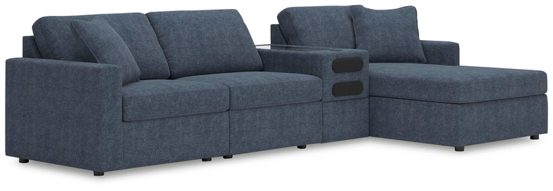 Ashley Furniture Modmax sectional with chaise, featuring plush cushions and modern design in a neutral fabric.