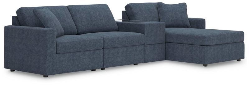 Ashley Furniture Modmax sectional with chaise, featuring plush upholstery and modern design in a stylish living room setting.