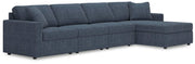 Ashley Furniture Modmax sectional with chaise, showing plush fabric upholstery and modern design in a spacious living room setting.