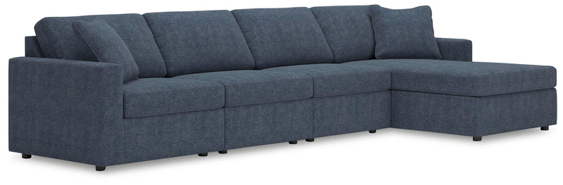 Ashley Furniture Modmax sectional with chaise, showing plush fabric upholstery and modern design in a spacious living room setting.