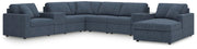 Ashley Furniture Modmax sectional with chaise, showcasing modern fabric upholstery and sleek design in a spacious living room setting.