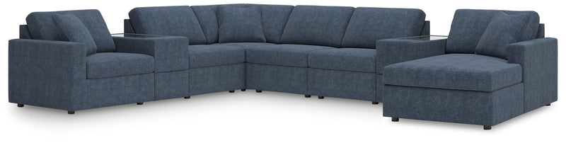 Ashley Furniture Modmax sectional with chaise, showcasing modern fabric upholstery and sleek design in a spacious living room setting.