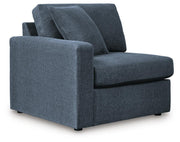 Ashley Furniture Modmax balanced sectional with built-in audio and storage consoles, shown from an angled view.
