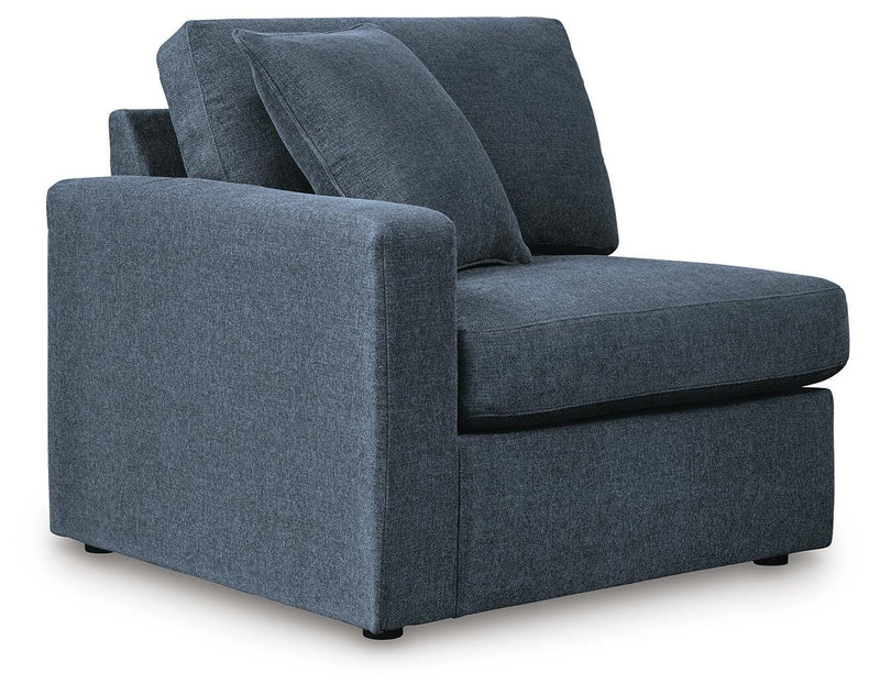 Ashley Furniture Modmax balanced sectional with built-in audio and storage consoles, shown from an angled view.