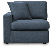 Ashley Furniture Modmax sectional with built-in audio, storage consoles, and modern design, shown from a head-on view.