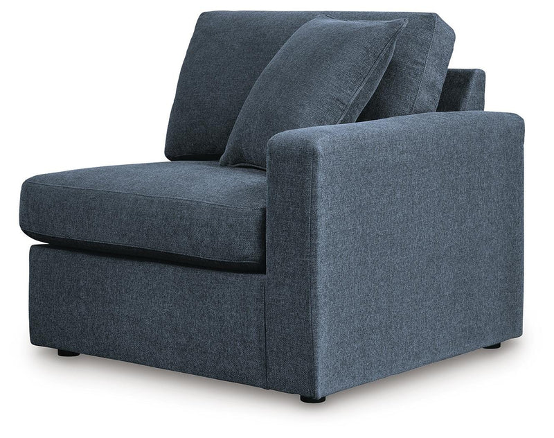 Ashley Furniture Modmax balanced sectional with built-in audio and storage consoles, shown from an angled perspective.