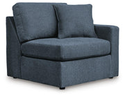 Ashley Furniture Modmax sectional with built-in audio, storage consoles, and modern design, shown from an angled view.