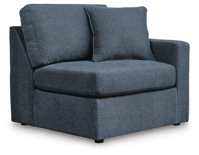 Ashley Furniture Modmax sectional with built-in audio, storage consoles, and modern design, shown from an angled view.
