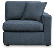 Ashley Furniture Modmax balanced sectional with integrated audio and storage consoles, featuring plush cushions and modern design.
