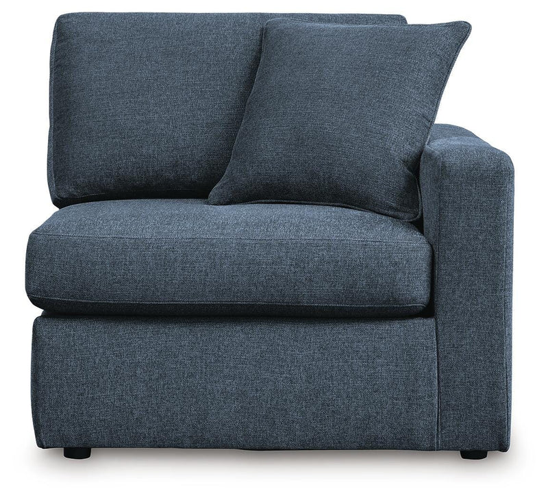 Ashley Furniture Modmax balanced sectional with integrated audio and storage consoles, featuring plush cushions and modern design.