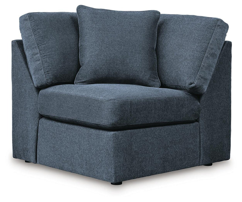 Ashley Furniture Modmax balanced sectional with integrated audio and storage consoles, shown in a head-on view.