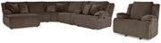Ashley Furniture Top Tier living room set with sofa and armchair in a modern design, featuring neutral fabric upholstery and decorative cushions.
