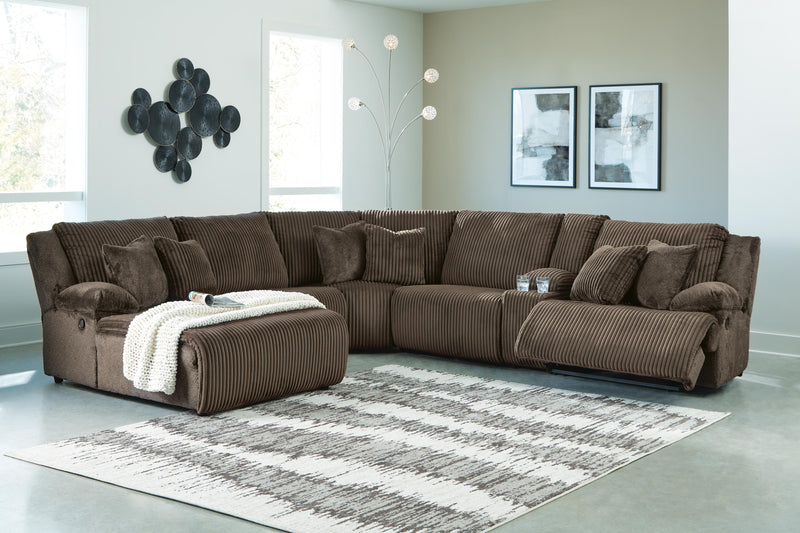 Ashley Furniture Top Tier reclining sectional with chaise, featuring plush fabric, multiple seating, and adjustable recline.