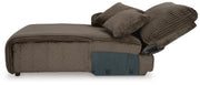 Ashley Furniture Top Tier sofa chaise sectional with plush cushions and modern design, shown from the side in a stylish living room setting.