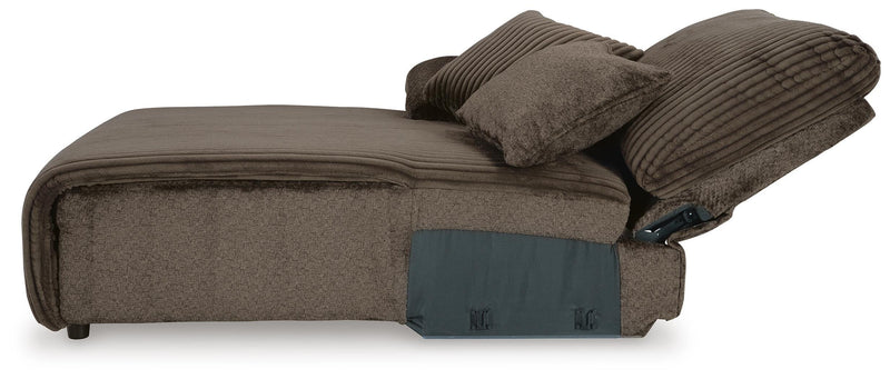 Ashley Furniture Top Tier sofa chaise sectional with plush cushions and modern design, shown from the side in a stylish living room setting.
