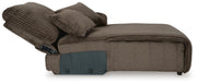 Ashley Furniture Top Tier sectional sofa chaise with beige upholstery and plush cushions, side view showing extended chaise lounge.