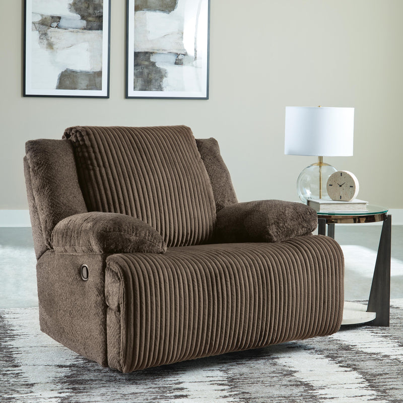 Ashley Furniture Top Tier Living Room Set with sofa and armchairs in a stylish, modern fabric, arranged in a contemporary living room.