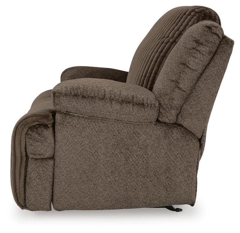 Ashley Furniture Top Tier living room set with matching sofa and armchair, beige fabric upholstery and plush cushions.