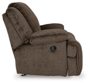 Ashley Furniture Top Tier recliner showing plush brown fabric and cushioned armrests with a side view.
