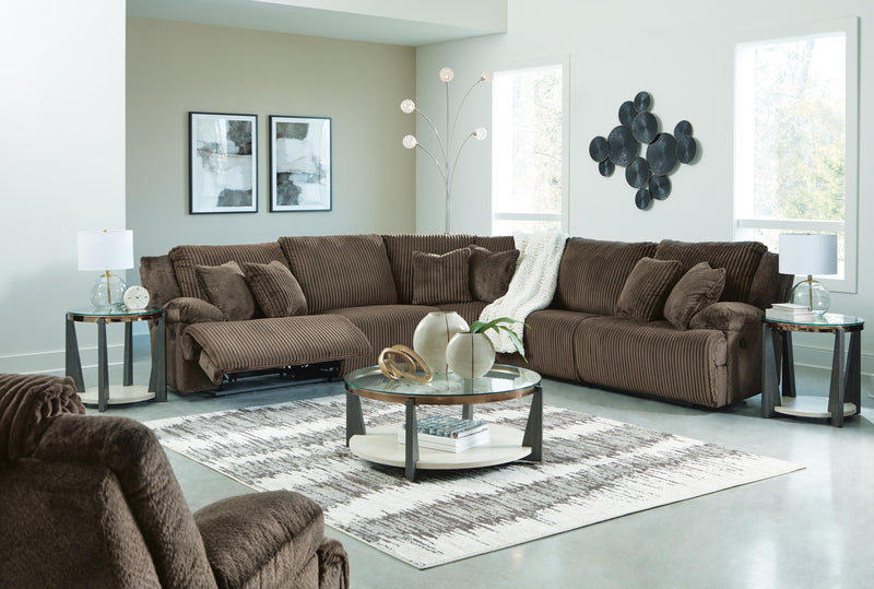 Ashley Furniture Top Tier living room set featuring a sofa, loveseat, and armchair with plush upholstery and modern design.
