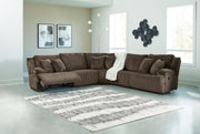 Ashley Furniture Top Tier living room set with sofa, armchair, and coffee table arranged in a modern living space.