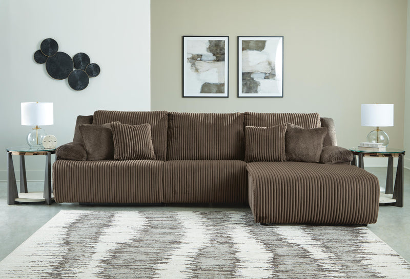 Ashley Furniture Top Tier sectional sofa chaise, modern chofa with plush cushions and sleek design, shown in a stylish living room setting.