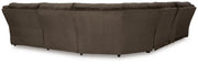Ashley Furniture Top Tier reclining sectional with chaise, showing plush cushions and reclining features in a modern living room setting.