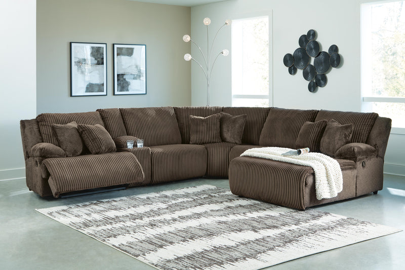 Ashley Furniture Top Tier reclining sectional with chaise, featuring plush cushions and a modern design for comfortable lounging.