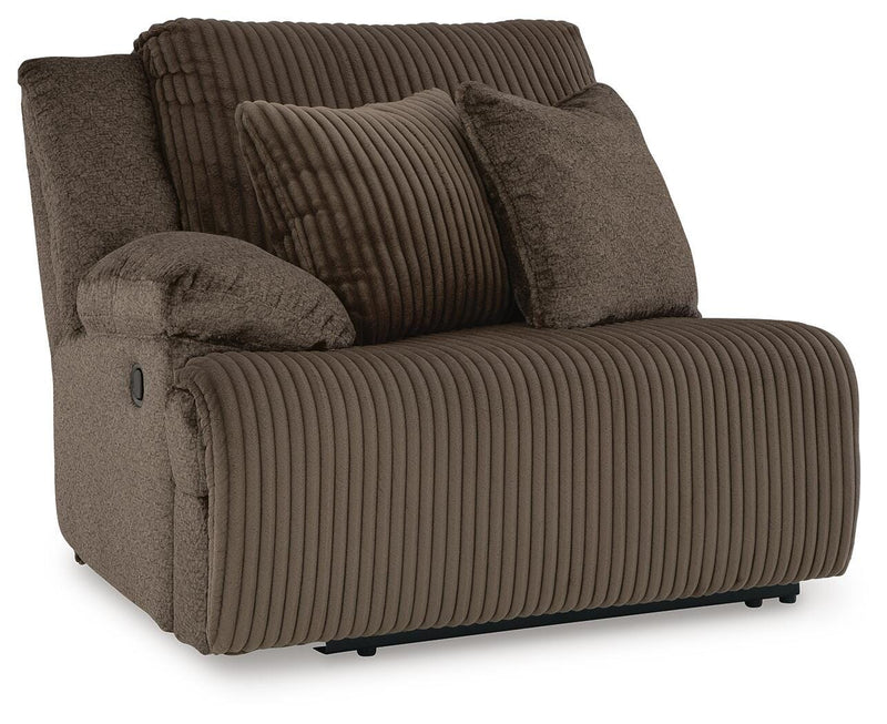 Ashley Furniture Top Tier sectional sofa chaise with plush cushions and modern design, viewed from an angled close-up.