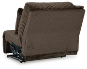 Ashley Furniture Top Tier sectional sofa with chaise, featuring plush cushions and modern design, shown from the back.