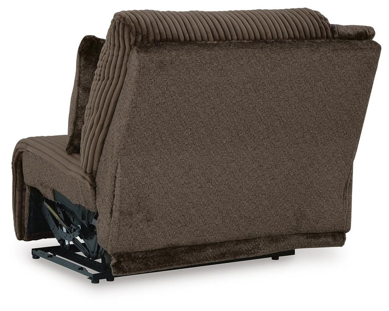 Ashley Furniture Top Tier sectional sofa with chaise, featuring plush cushions and modern design, shown from the back.