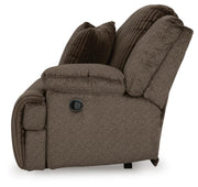 Ashley Furniture Top Tier sofa chaise sectional with plush cushions and fabric upholstery, shown from the side.