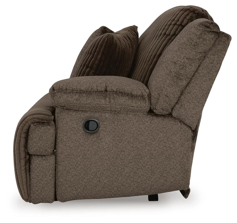 Ashley Furniture Top Tier sofa chaise sectional with plush cushions and fabric upholstery, shown from the side.
