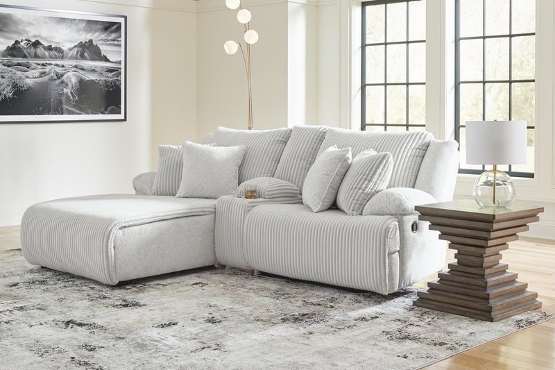 Ashley Furniture Top Tier reclining sectional sofa with chaise, showcasing plush fabric, reclining seats, and a spacious design.